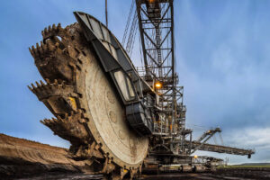 A very large machine with bucket wheel shovels in a sand pit
