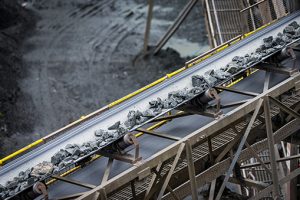 Stones are transported on a conveyor belt during the mining process