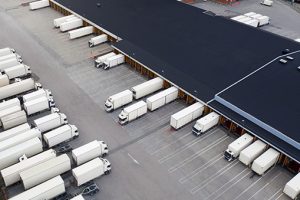 drone view of a fleet with several white trucks